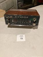 Full view of the radio showing the control and tuning panel with buttons, knobs, and frequency scale.