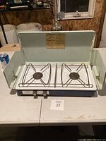 Front angle of the Primus camp stove showing the two burners and wind guards.