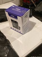 Boxed Cazon Upper Arm Intelligent Type Digital Blood Pressure Monitor B26, showing front and side panels of the box with product image and model details.