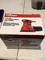 Box front showing image and details of the Hyper Tough 2.0 Amp Random Orbital Palm Sander 5 inch