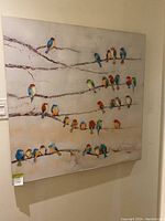 Full canvas wall art showing multiple colorful birds perched on tree branches.
