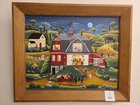 Front view of framed folk art painting depicting a barn dance scene at night with multiple figures, barn, houses, hills, and moon under a starry sky.