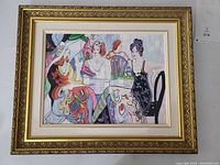 Front view of framed painting showing three women at a tea table.