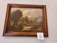 Front view of the framed painting showing the Scottish stream landscape.