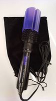 Infiniti Pro by Conair rotating air brush hair dryer with power cord and black storage bag, purple plastic styling cover attached over brush head.