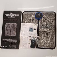 Box for EMS Foot Massager showing brief product description and a diagram of the foot massager mat.
