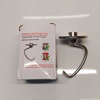 Dough hook displayed next to its box showing compatibility info for 4.5 and 5 quart tilt-head stand mixers, made of 304 stainless steel.