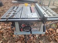 Top view showing cast iron table top, rip fence and blade opening