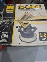 Box of WEN 10 inch orbital car buffer, showing product branding, model name 'the detailer' and motor power rating of 1/2 HP.