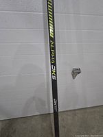 Close-up of the shaft with ALPHA DX5 branding and design details