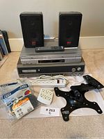 Full view of lot including SVI speakers, Sony audio components, accessories, and cables