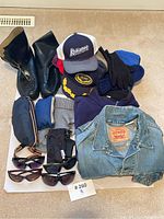 Overall lot including boots, hats, gloves, sunglasses, bags, and jacket