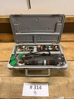 Overview photo of Sears Craftsman rotary tool and accessories inside opened gray molded plastic carrying case.