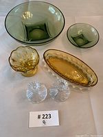 Top-down photo showing all six glassware pieces on a white surface with lot number card visible.