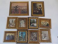10 framed art prints arranged on a floor showing all prints in the lot