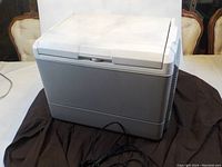 Front view of the Coleman travel cooler showing the exterior casing and cord.