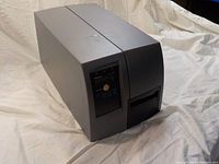 Right side angled view of the gray Intermec EasyCoder PM4i label printer, showing the general size and shape.