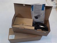 Two new Lorex LBV2711TB 1080p MPX IR bullet cameras sealed in boxes with included cables and manuals.