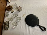 Photo showing entire lot with cutlery rests, salt and pepper set, mirror, and decorative boxes