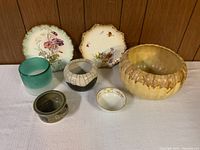 Seven decorative plates and bowls including Nippon porcelain plates and various ceramic bowls