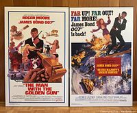 Photo showing both James Bond movie posters mounted on fibreboard, side by side.