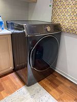Side angle of dryer showing left side and front profile