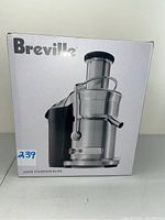 Front view of the Breville Juice Fountain Elite 800JEXL/B in its original retail box showing the product image and model.