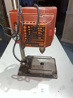 Front view of the Edison 1/2" drill press showing the base, column, drill head and electrical cord.