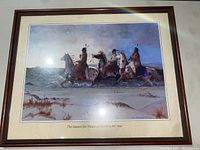 Framed print showing four Native American riders on horses in a winter landscape with snow and a blue sky at dusk, artist signed Echohawk, framed with matting showing print title.