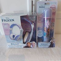 Photo of the boxed set showing the Disney Frozen Bluetooth headphones and microphone.