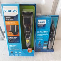 Philips Series 3000 Beard Trimmer and Philips NT3000 Nose Hair Trimmer in original sealed boxes, side-by-side.