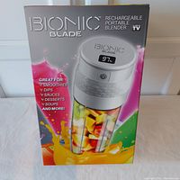 Front view of the boxed Bionic Blade Rechargeable Portable Blender showing product image and highlights of usage.