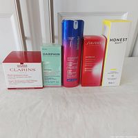 Five skincare products lined up, showing boxed packaging from different brands.