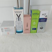 Front view of all five skincare product boxes arranged in a row, showing packaging and branding.