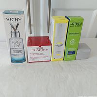 Full view of all five skincare products boxed and sealed.