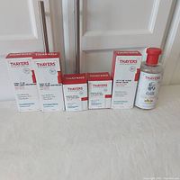 Full lot of six Thayers skincare products arranged in a row: two moisturizers, two creams, one water cream, and one toner.