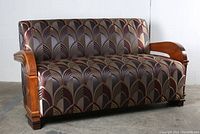 Full front view of loveseat showing overall shape and upholstery pattern