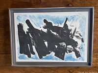 Full view of framed abstract lithograph with black and blue brush strokes by Avshalom Okashi.
