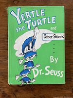 Front cover of book with original dust jacket showing title, author, and turtle illustrations