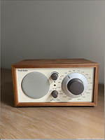 Front view of Tivoli Model One radio showing wood cabinet and tuning dials.