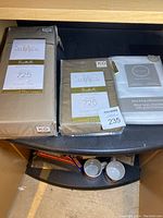 King bedding set including sheets and pillowcases laid out showing brand and thread count labels.