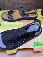 Side and top view of two pairs of women's Naot sandals showing design and condition.