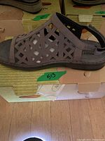 Side profile close-up of the Naot sandal showing the smoke gray nubuck lattice design and sole