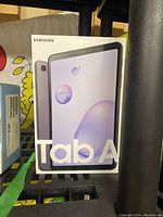 Box of Samsung Galaxy Tab A tablet showing front and back of box.