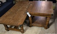 Photo showing the coffee table and side table side by side, displaying their matching rustic oak wood tops, corkscrew legs, and metal corner details.