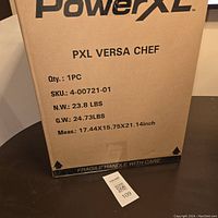 Box of PowerXL Versa Chef 4-in-1 multi-cooker with product and packaging details visible.
