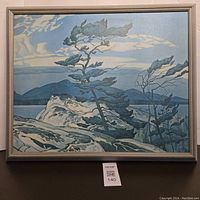 Framed vintage print showing pine trees with rocky landscape and mountains in background