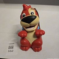 Front view of the vintage Mattel Red Rover Bone dog toy, showing full face and front paws raised.