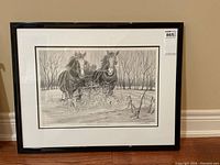 Framed lithographic reproduction sketch depicting two horses crossing a cornfield in a naturalistic setting with bare trees in the background.