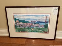 Framed full view of watercolour lithograph featuring marina, buildings, greenery, and the Golden Gate Bridge in background.